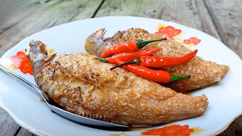 A close-up image of the dish, showcasing the tender fish and flavorful sauce