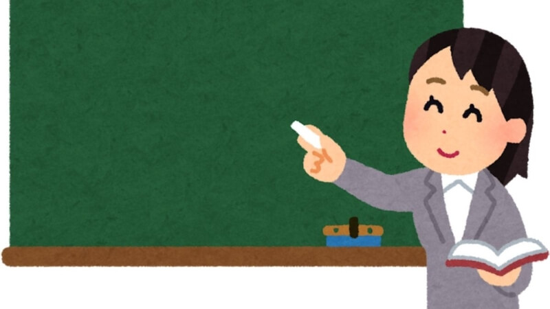 Hình chibi cô giáo mặc áo vest sang trọng, thân thiện