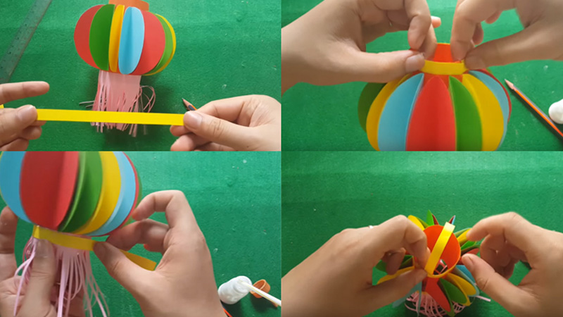 Cắt thêm một dải giấy 12 x 1cm để làm quai xách và gắn lên trên.